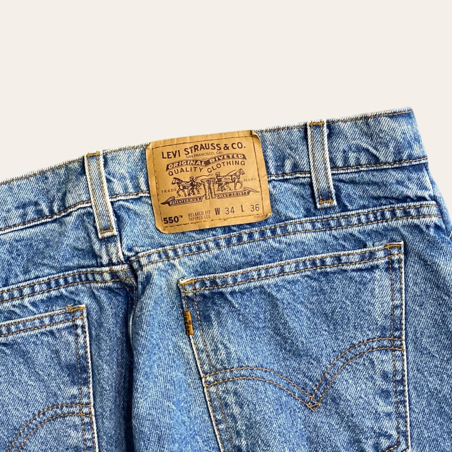 Vintage Levi's 550 Orange Tab Jeans Size 34